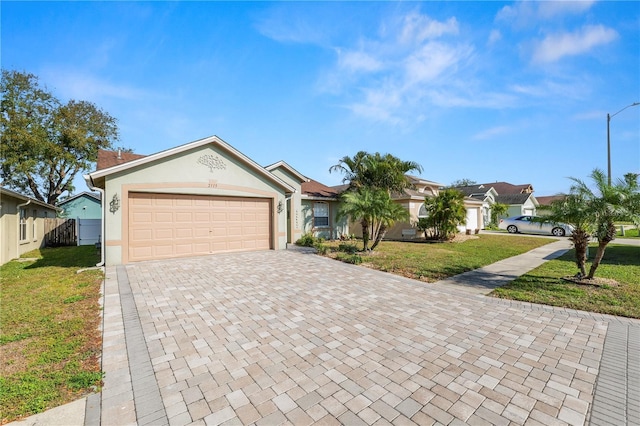 single story home with a front lawn and a garage