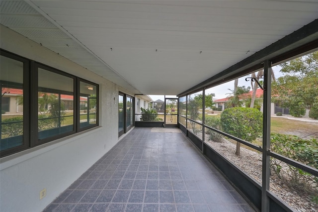 unfurnished sunroom with a wealth of natural light