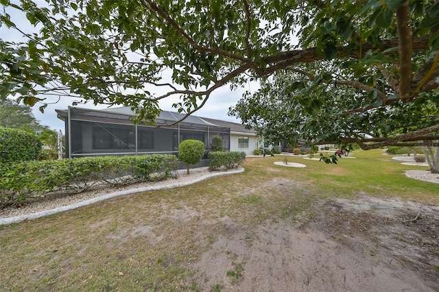 view of yard featuring a lanai