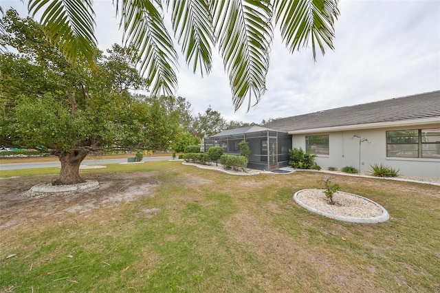 view of yard featuring a lanai