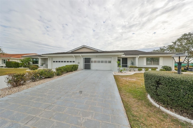 ranch-style home featuring a garage