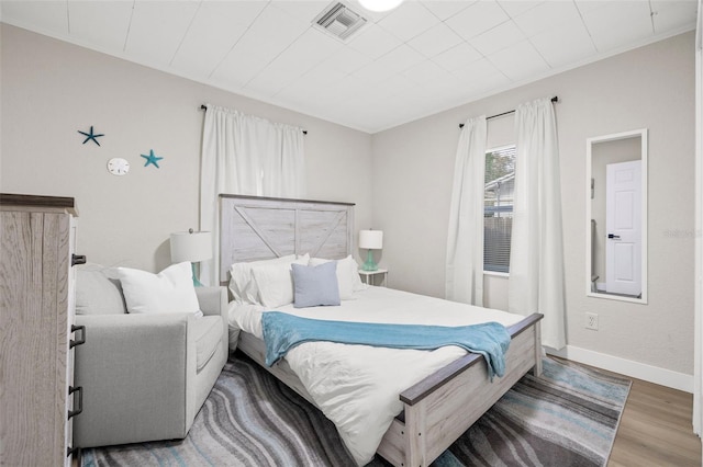 bedroom featuring hardwood / wood-style floors