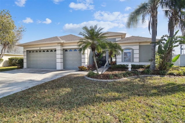 view of front of property with a front lawn and a garage