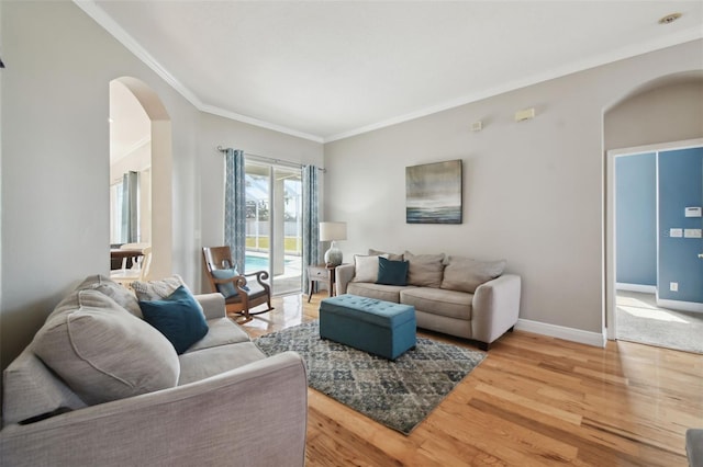 living room featuring hardwood / wood-style floors and crown molding