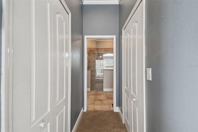 hall featuring light colored carpet