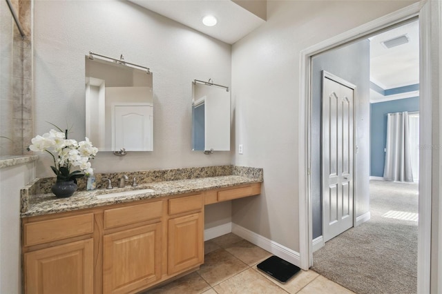 bathroom with vanity and tile patterned flooring