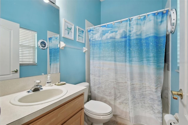 full bathroom with shower / bath combo, vanity, and toilet