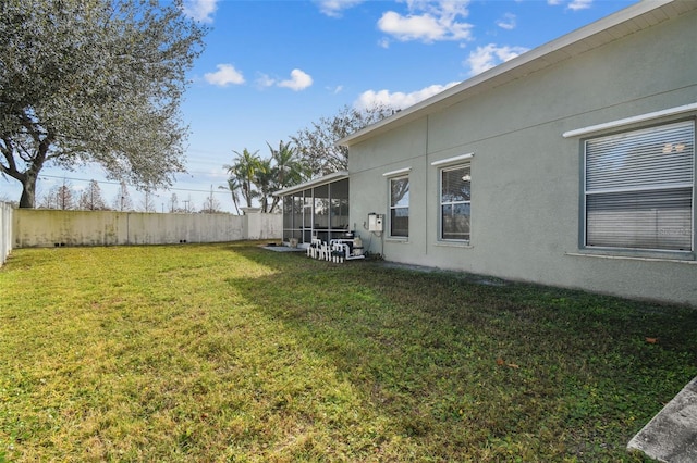 view of yard featuring a sunroom