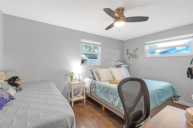 bedroom with ceiling fan and hardwood / wood-style flooring