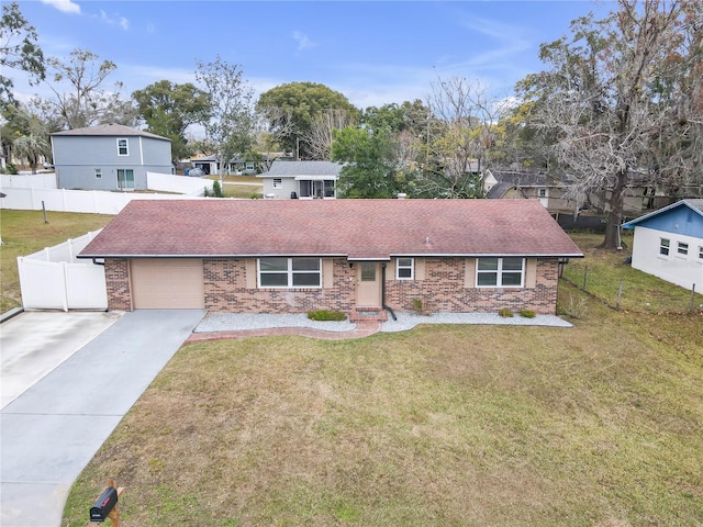 view of front of house featuring a garage and a front lawn