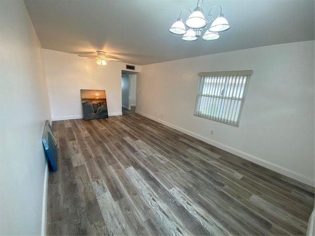 unfurnished living room featuring dark hardwood / wood-style flooring and ceiling fan