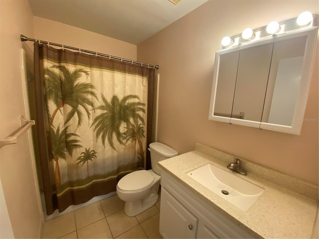 bathroom with tile patterned floors, toilet, curtained shower, and vanity