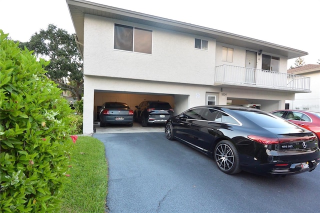 view of front of house with a balcony and a garage