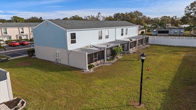 back of house with a yard