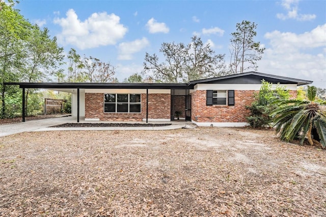 view of front of home with a carport