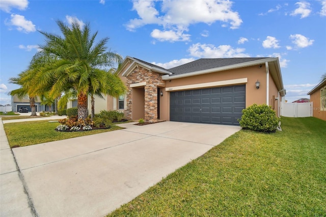 view of front of property with a front lawn and a garage