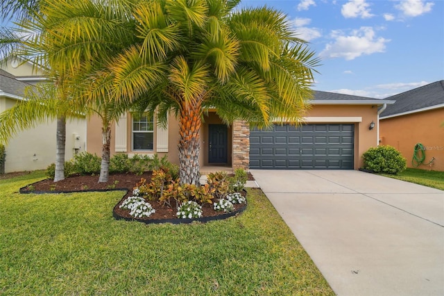 view of front of house featuring a front yard and a garage