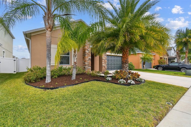 mediterranean / spanish house featuring a front yard