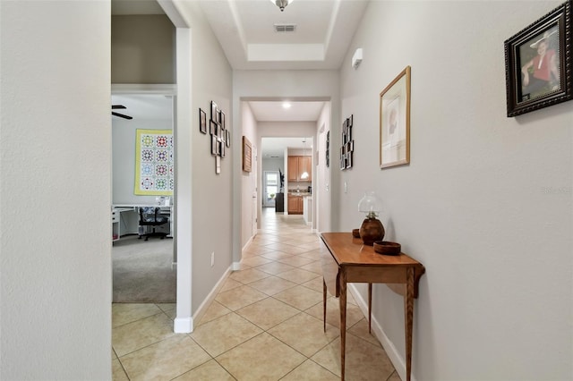 corridor featuring light tile patterned flooring