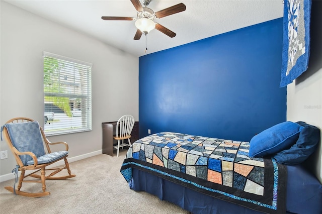 bedroom featuring ceiling fan and carpet flooring