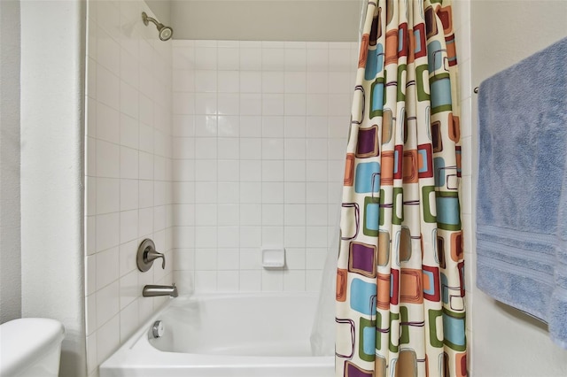 bathroom featuring toilet and shower / bath combo