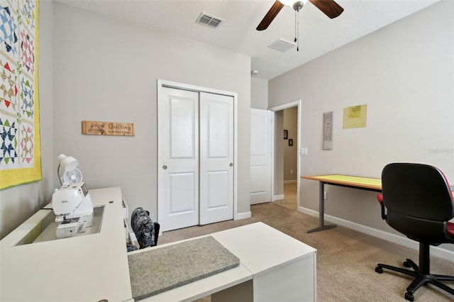 carpeted home office with ceiling fan