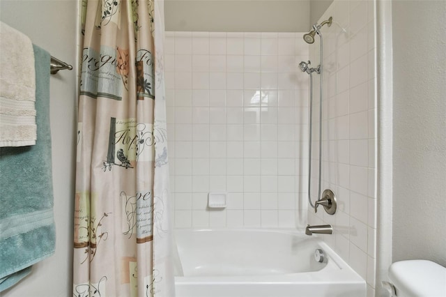 bathroom with toilet and shower / bathtub combination with curtain