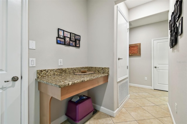 bathroom with tile patterned flooring