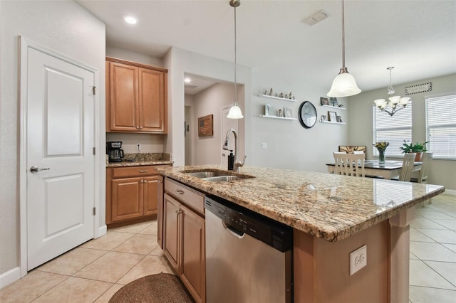 kitchen featuring an inviting chandelier, sink, light tile patterned flooring, stainless steel dishwasher, and a center island with sink