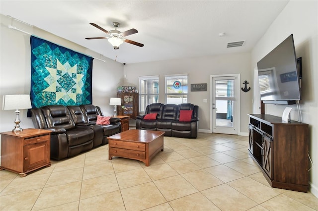 living room with ceiling fan and light tile patterned floors