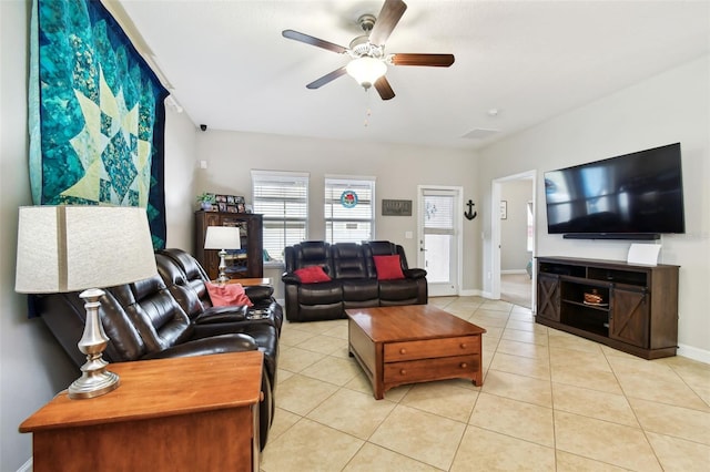 living room with ceiling fan and light tile patterned floors