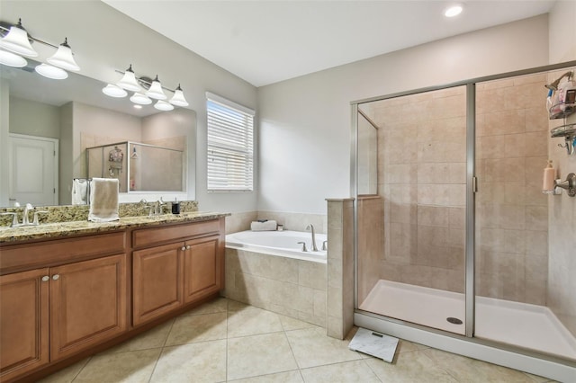 bathroom with vanity, tile patterned floors, and plus walk in shower