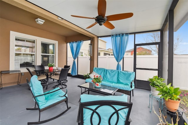 sunroom / solarium with ceiling fan