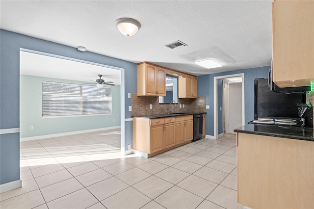 kitchen with sink, light brown cabinets, ceiling fan, light tile patterned floors, and tasteful backsplash