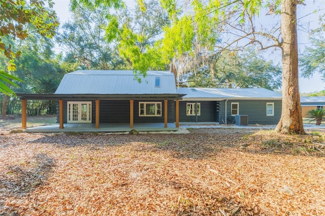 view of front of home featuring french doors and central AC