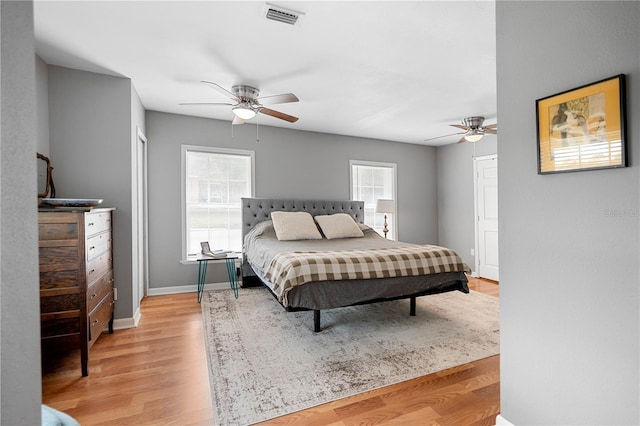 bedroom featuring ceiling fan and light hardwood / wood-style flooring