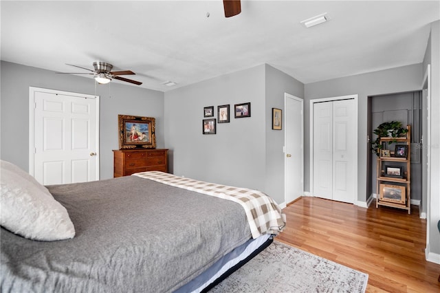 bedroom with ceiling fan and hardwood / wood-style flooring