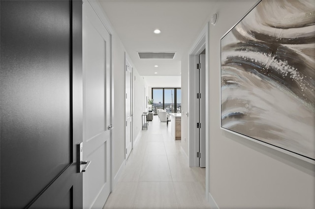 hallway with light tile patterned floors