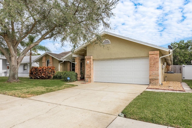 view of front of property with a front yard and a garage