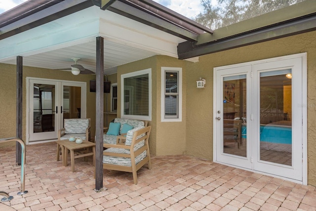 view of patio featuring ceiling fan and french doors