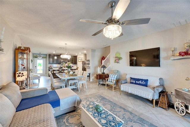 tiled living room with ceiling fan