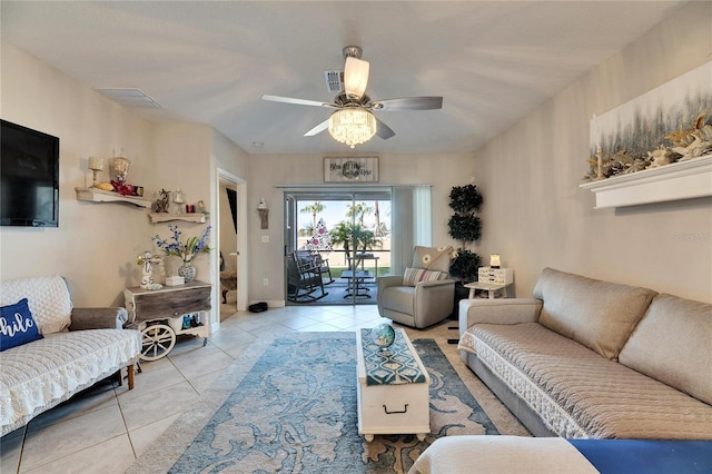 tiled living room featuring ceiling fan