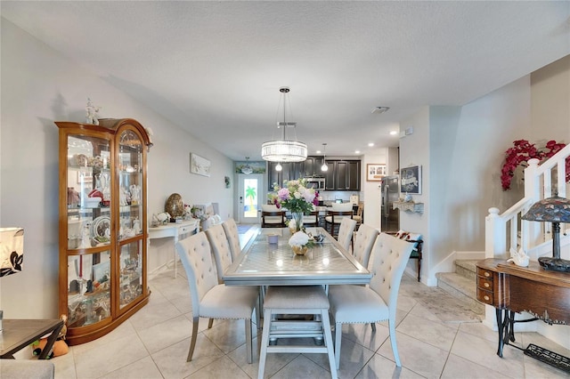 dining space with light tile patterned floors