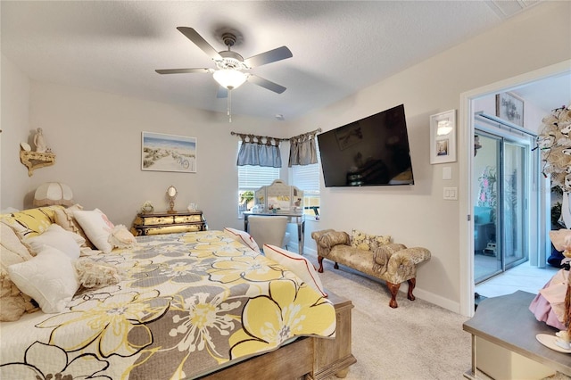 carpeted bedroom featuring a textured ceiling, ceiling fan, and access to outside