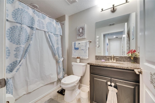 full bathroom featuring a textured ceiling, toilet, tile patterned floors, shower / bath combo with shower curtain, and vanity