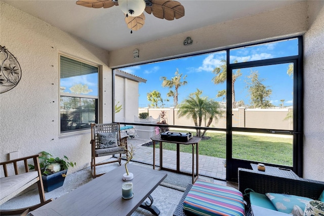 sunroom / solarium with ceiling fan