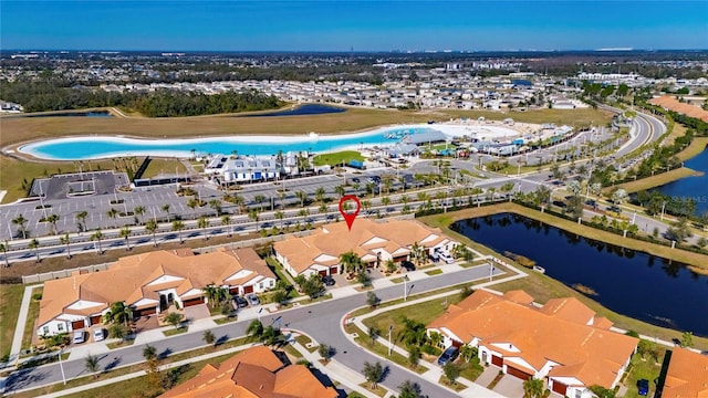 birds eye view of property featuring a water view