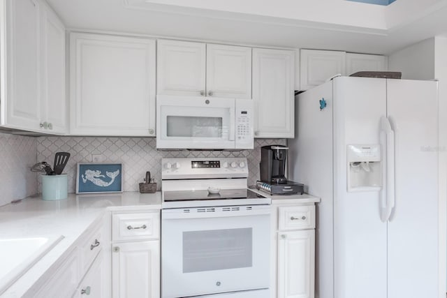 kitchen featuring white cabinetry, sink, white appliances, and tasteful backsplash