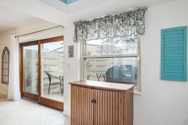 entryway with light tile patterned floors