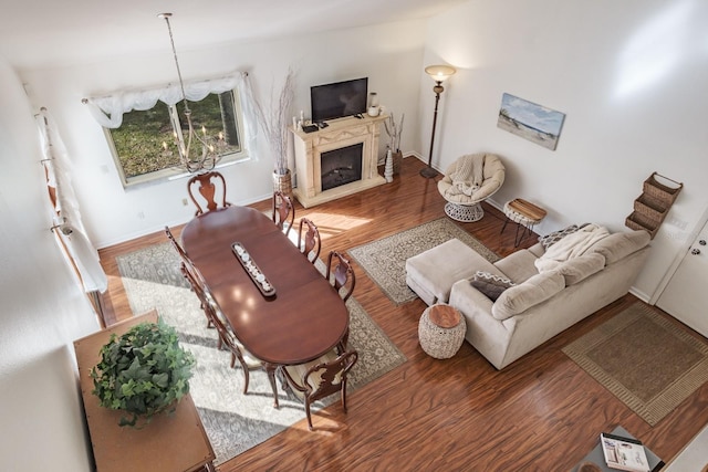 living room featuring dark hardwood / wood-style flooring and a notable chandelier